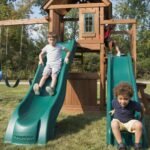 Swing-N-Slide WS 8353 Knightsbridge Deluxe Wooden Swing Set with Two Slides Climbing Wall Swings Glider & Picnic Table Wood - Image 2