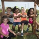 Swing-N-Slide WS 8353 Knightsbridge Deluxe Wooden Swing Set with Two Slides Climbing Wall Swings Glider & Picnic Table Wood - Image 7