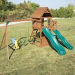 Swing-N-Slide WS 8353 Knightsbridge Deluxe Wooden Swing Set with Two Slides Climbing Wall Swings Glider & Picnic Table Wood - Image 6