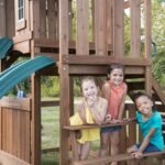 Swing-N-Slide WS 8353 Knightsbridge Deluxe Wooden Swing Set with Two Slides Climbing Wall Swings Glider & Picnic Table Wood - Image 5